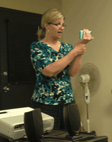 Cindy Burgess demonstrates how to hold your arm to stabilize iPhone video